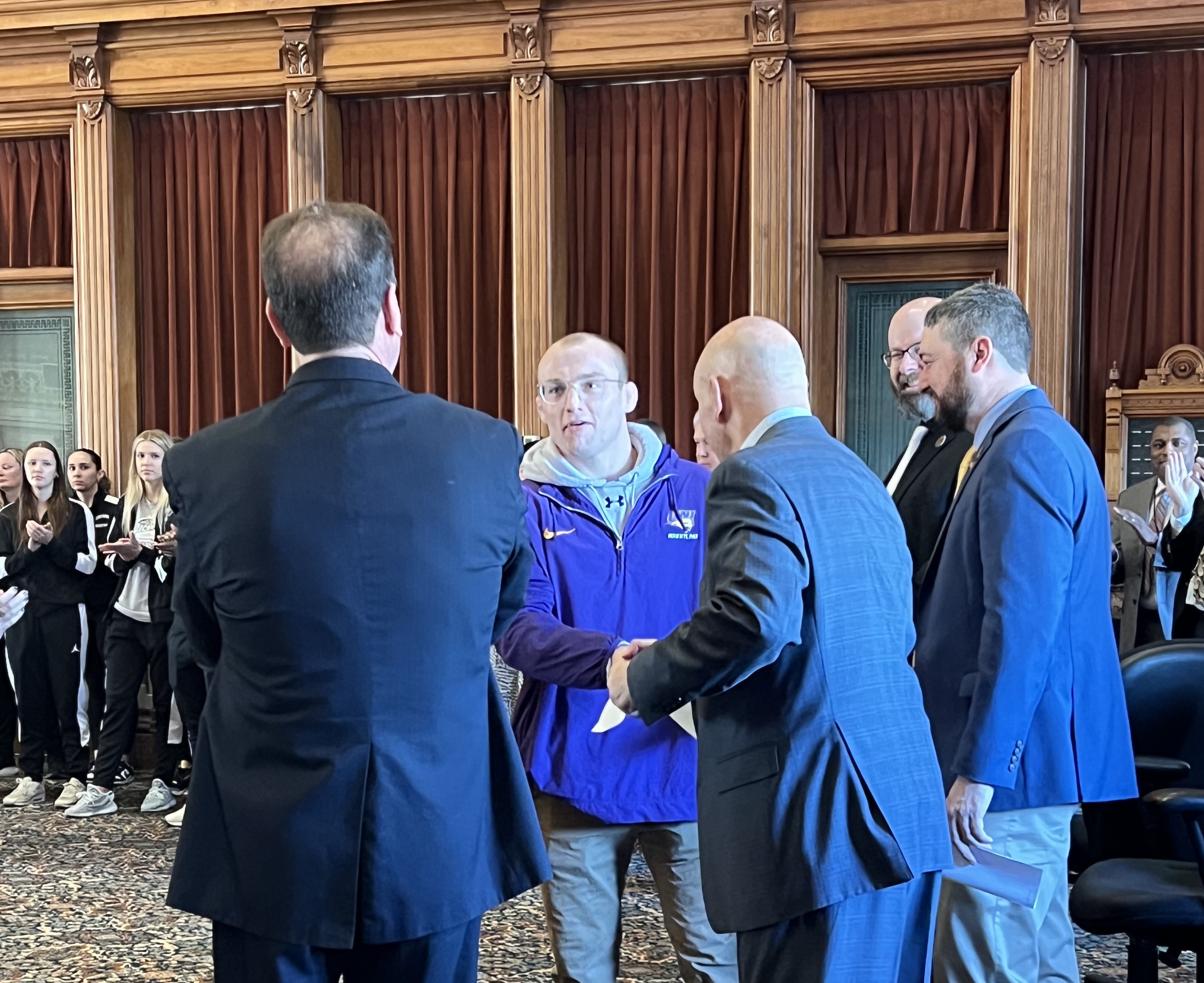 Parker Keckeisen shaking hands with lawmakers