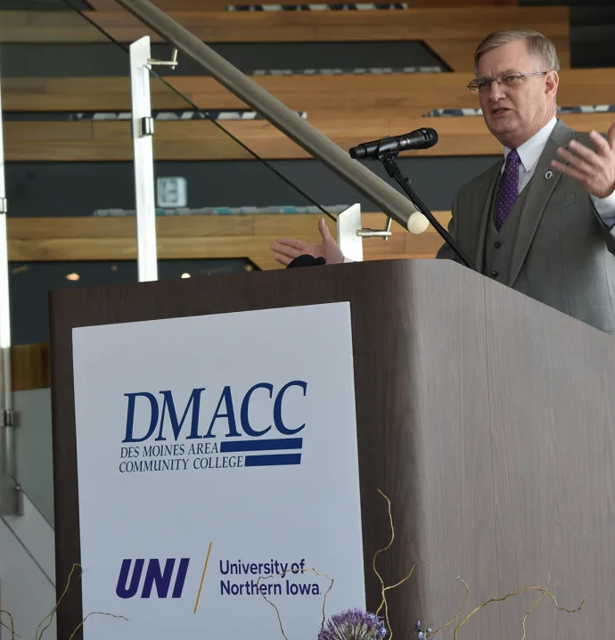 UNI President Mark Nook behind podium at UNI@DMACC event