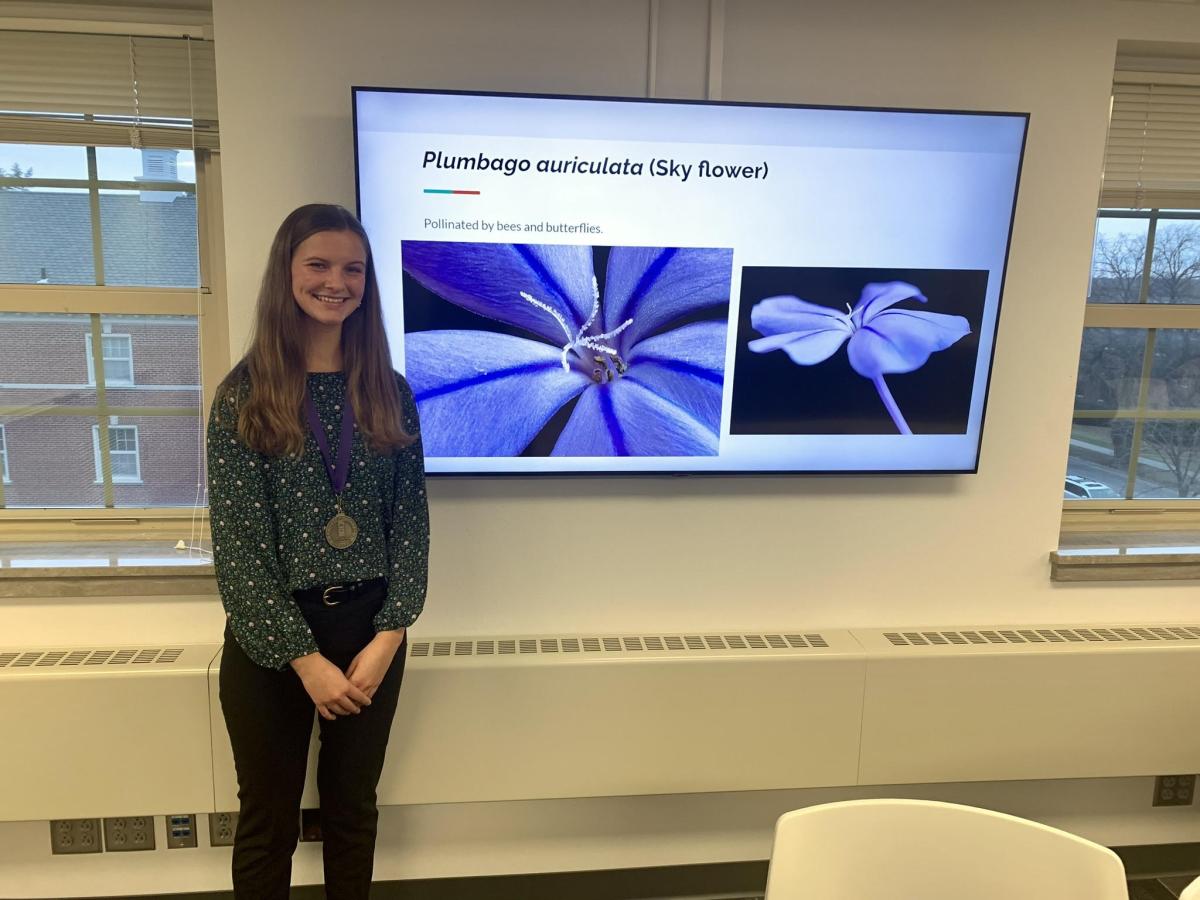 Bethany Van Dusseldorp in front of her research