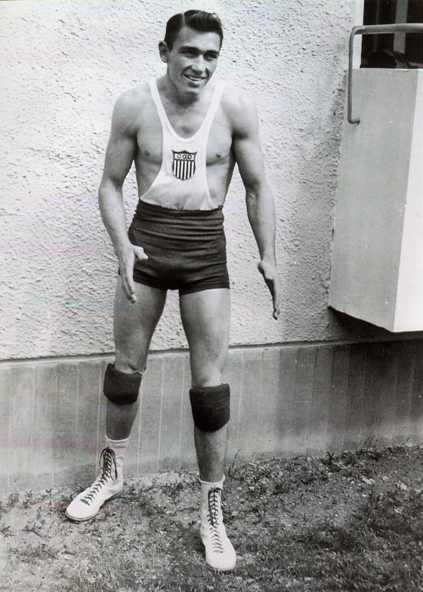 Bill Smith in black and white) in wrestling gear