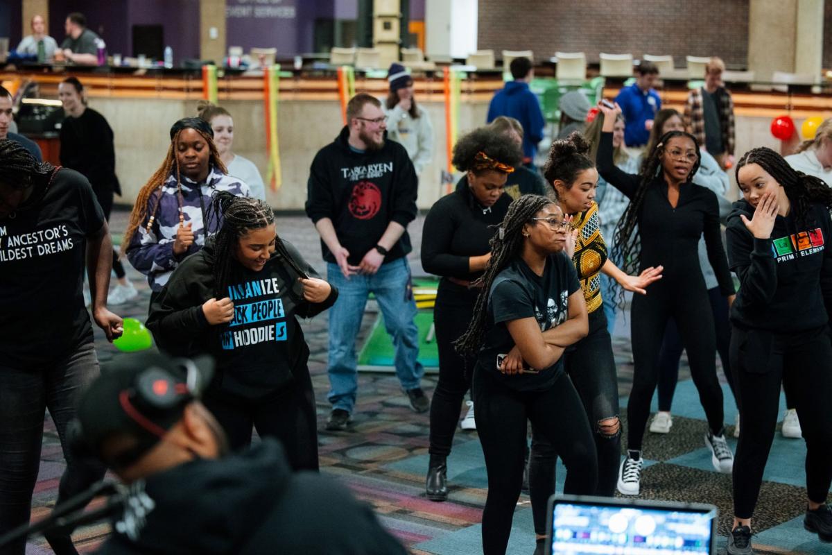 People dance at the Black History Month kickoff