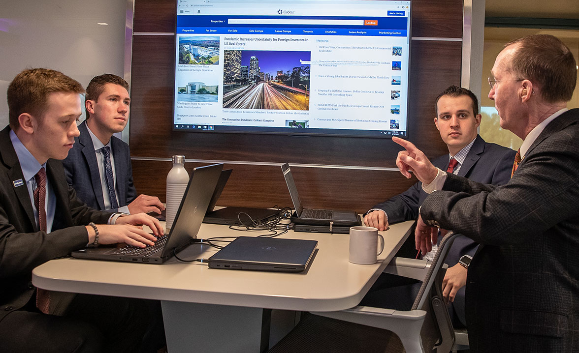 business students in classroom with professor art cox at the university of northern iowa