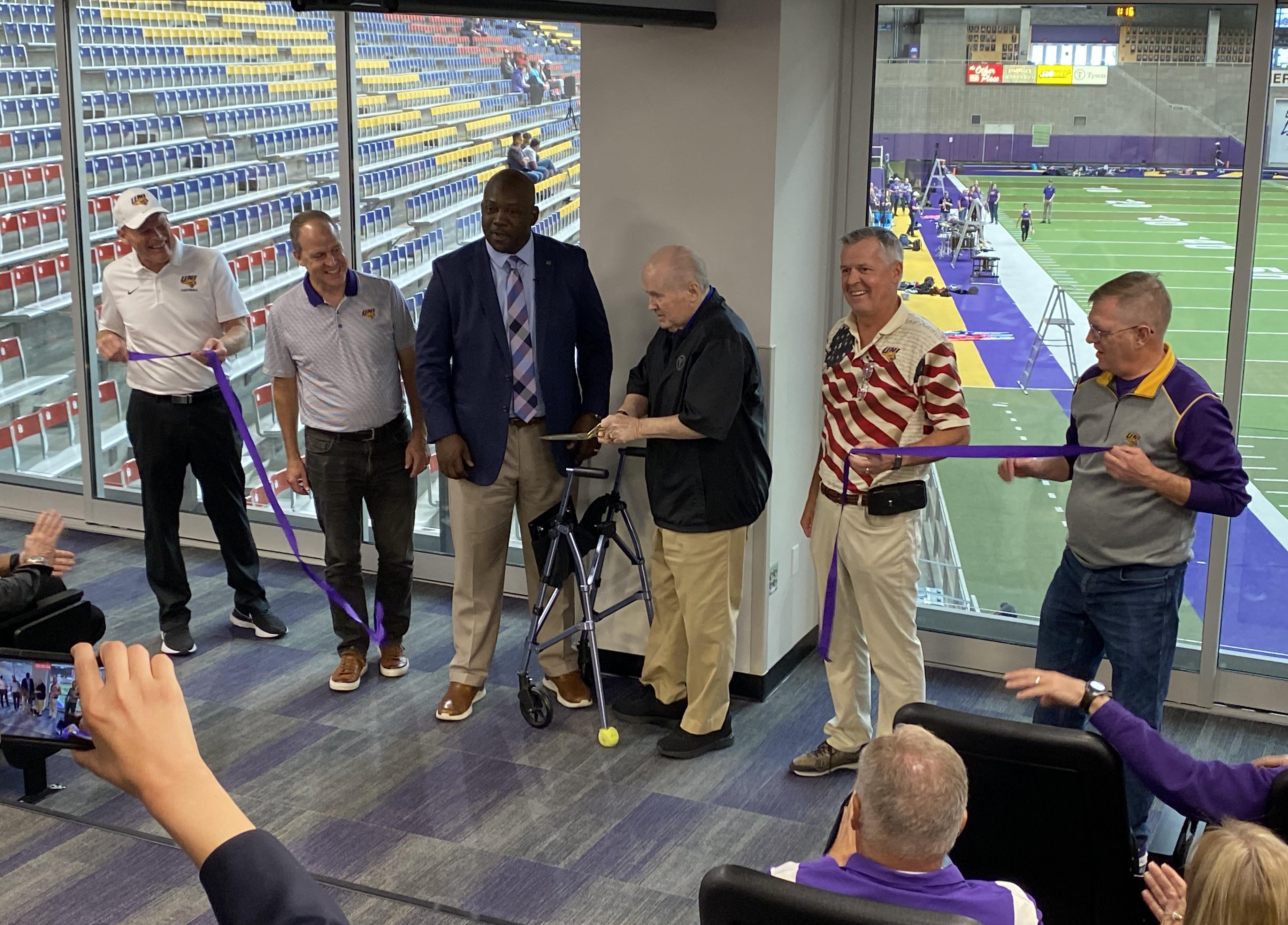 Football team room ribbon cutting