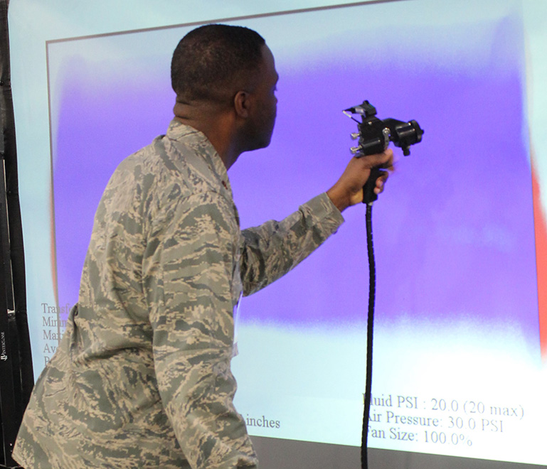 Person in uniform using virtual paint program