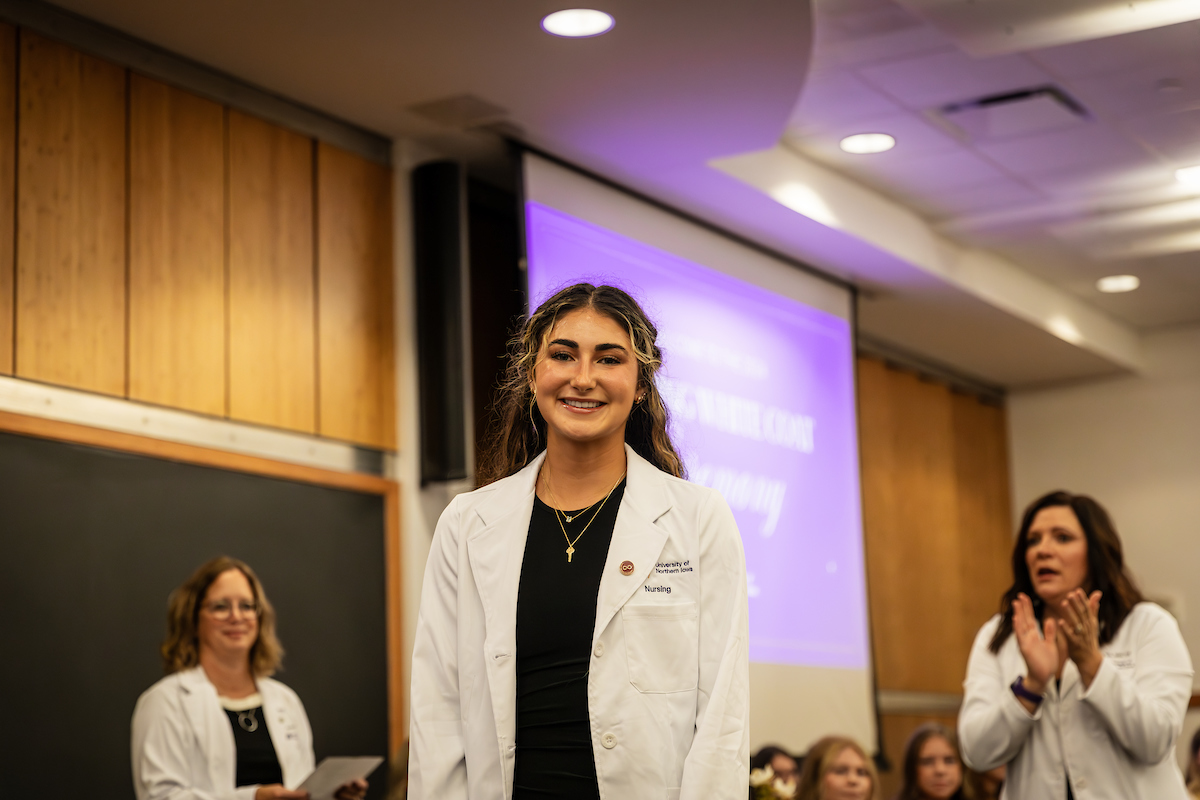 UNI student wearing white coat for the first time