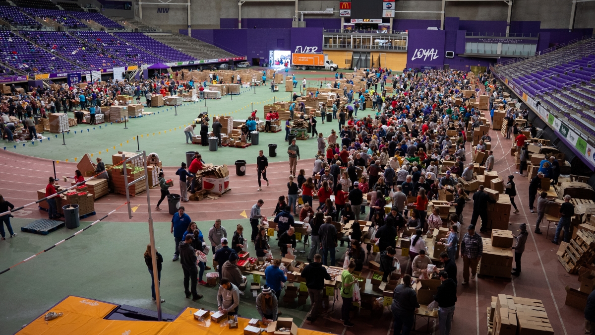 Volunteers crowd the UNI-Dome for Pack the Dome