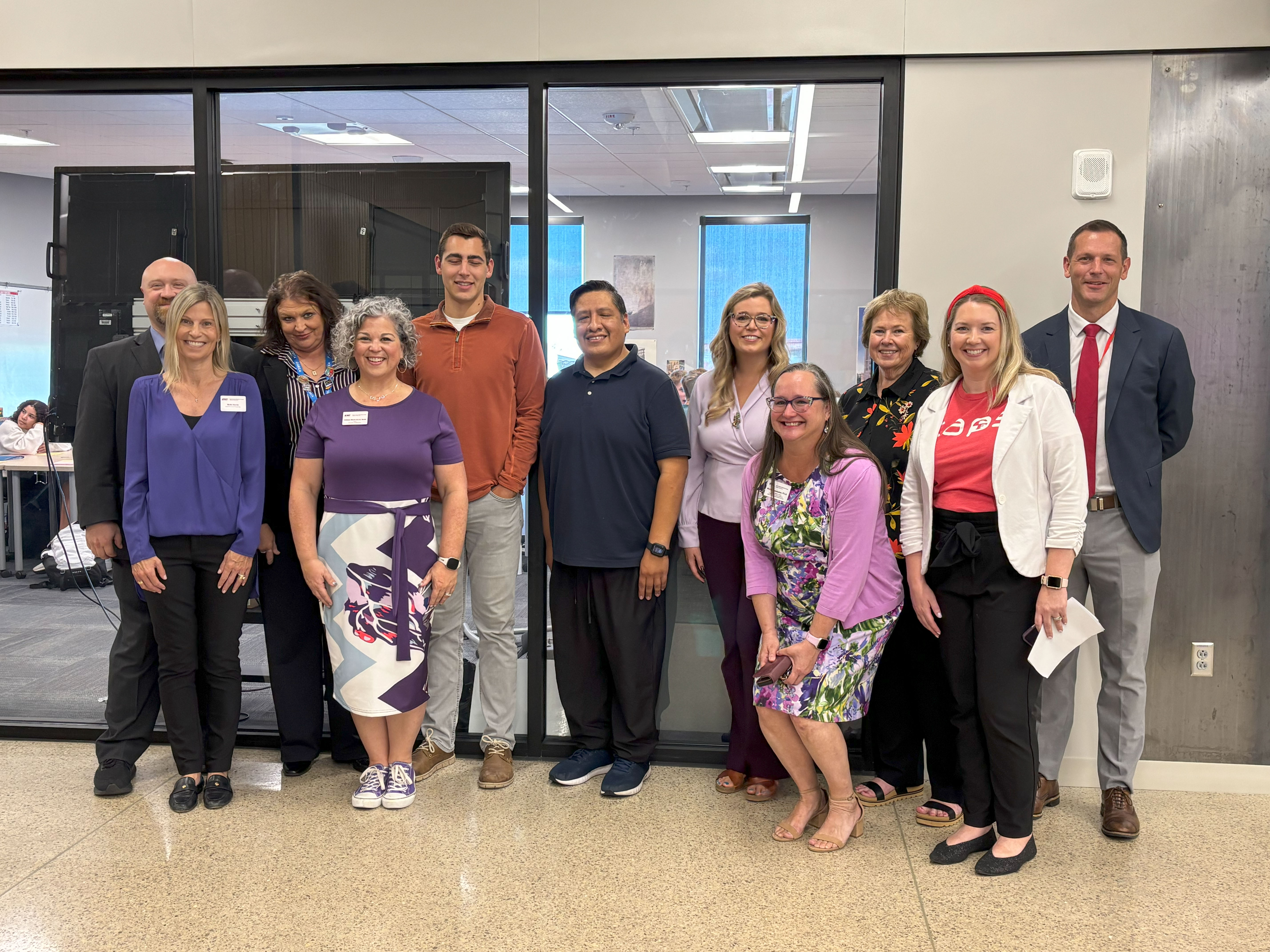 State leaders with UNI and Cedar Falls High School faculty, staff and student teachers