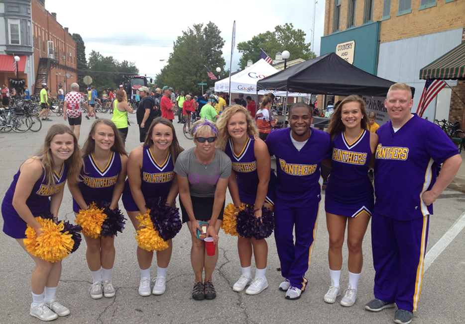 Sharon Hannasch with UNI cheerleaders.
