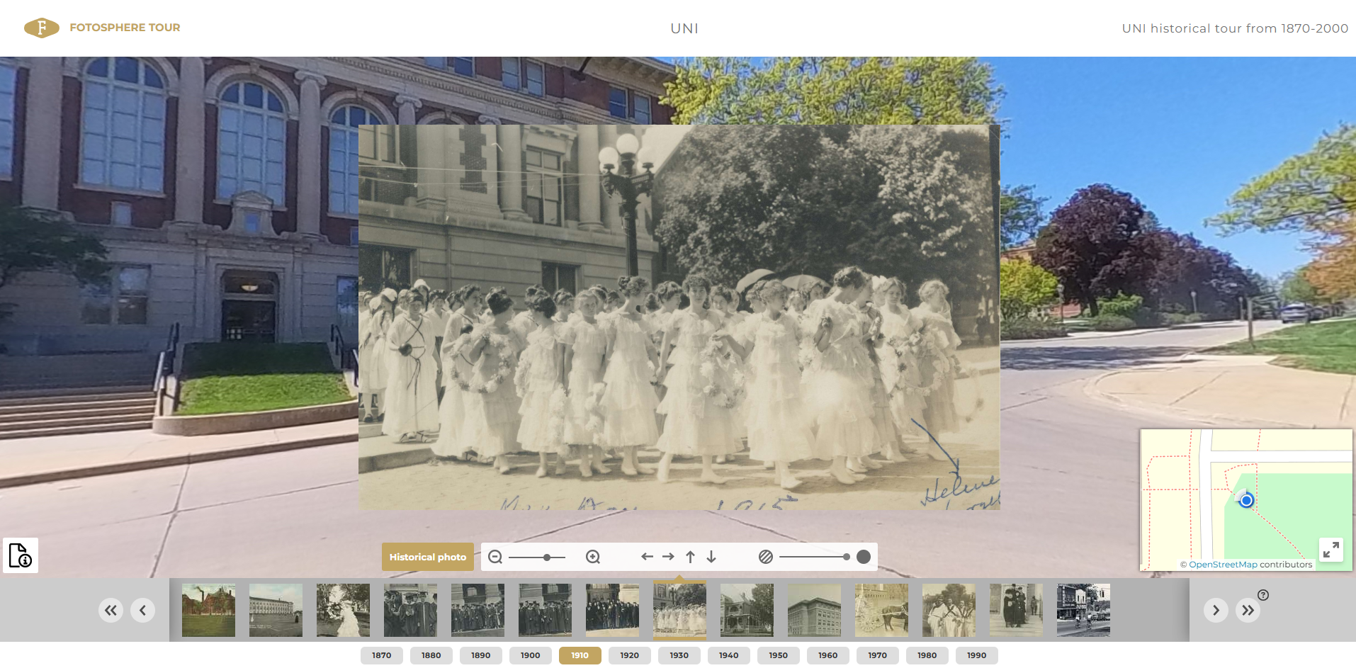 Women dressed in gowns walking on UNI campus in 1910