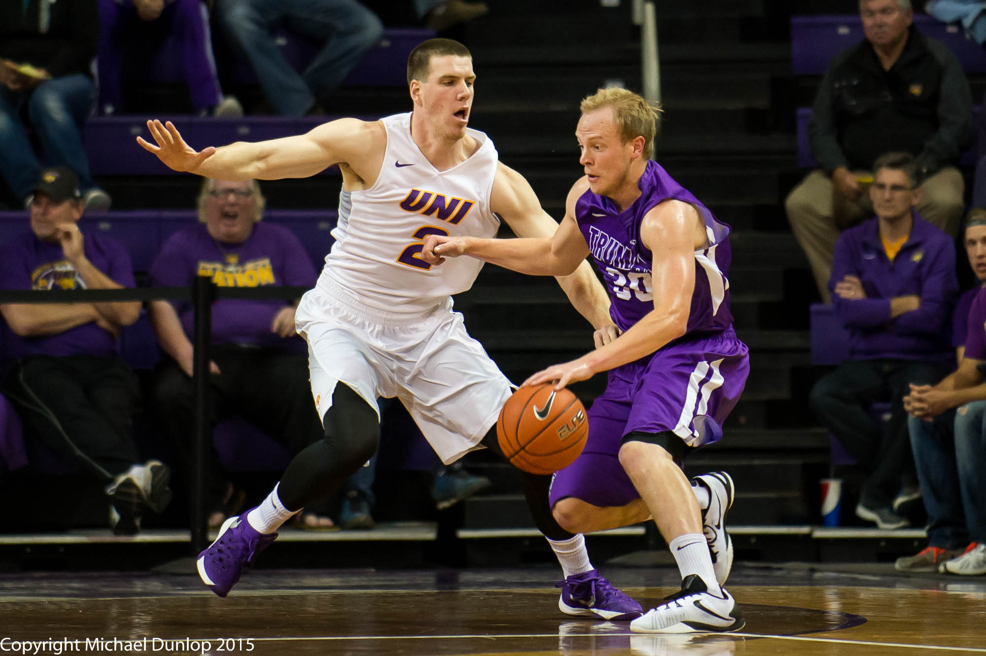 Klint Carlson in UNI uniform playing basketball