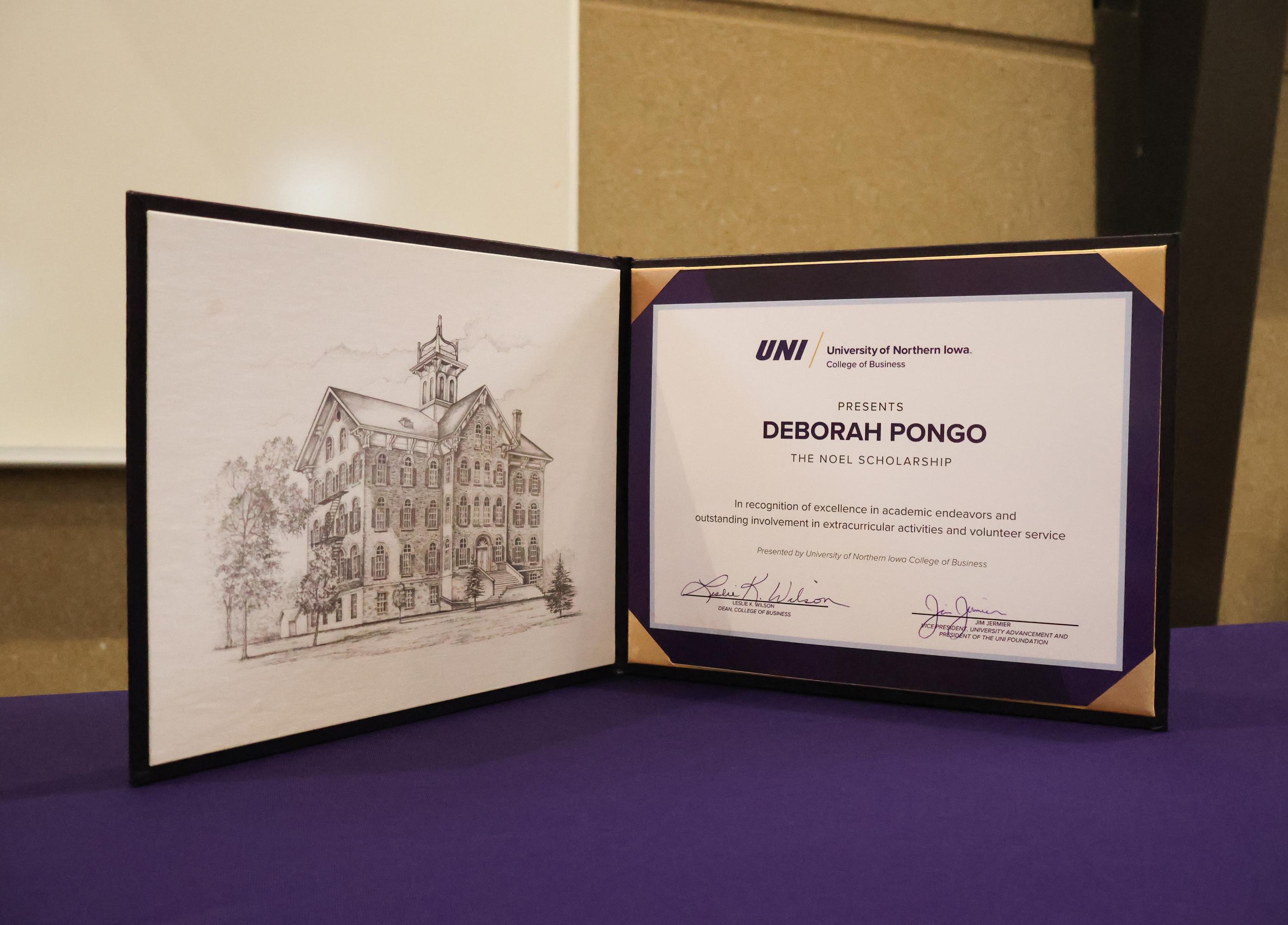Pongo's full ride scholarship certificate.