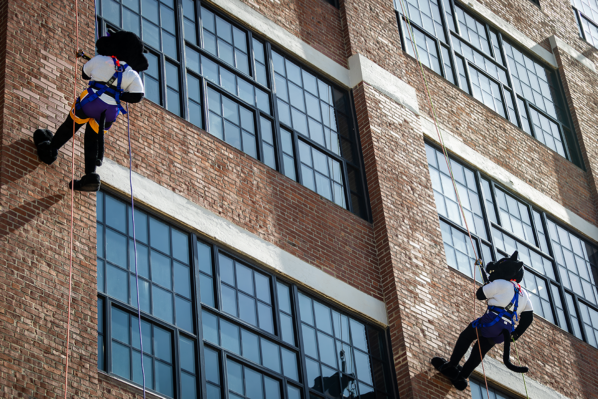 TC and TK captured while rappelling off six story building. 