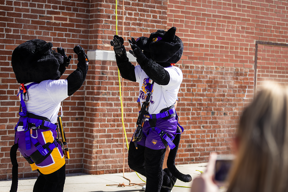 TC and TK high-five after rappelling Techworks building. 