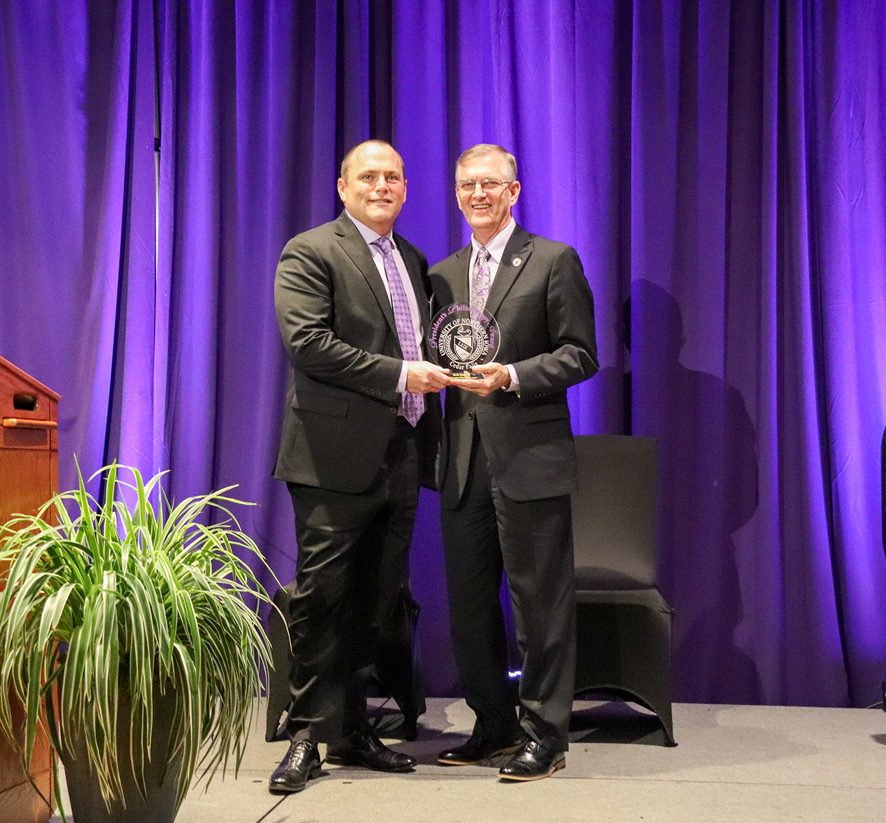 Kevin Zaugg receives an award from UNI President Mark Nook