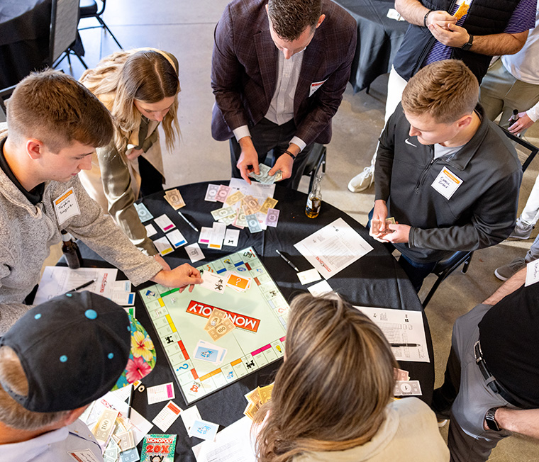 Des Moines Monopoly tournament raises funds and awareness for UNI's real estate education program, bringing together students, alumni, and professionals for a fun and competitive eve
