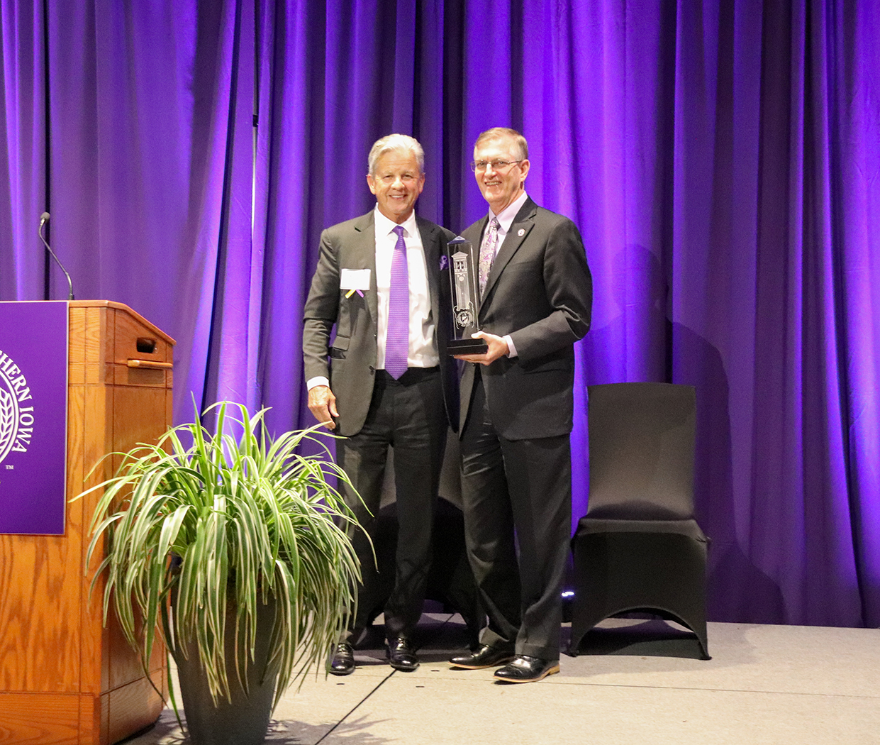 Paul Donahue receives an award from UNI President Mark Nook