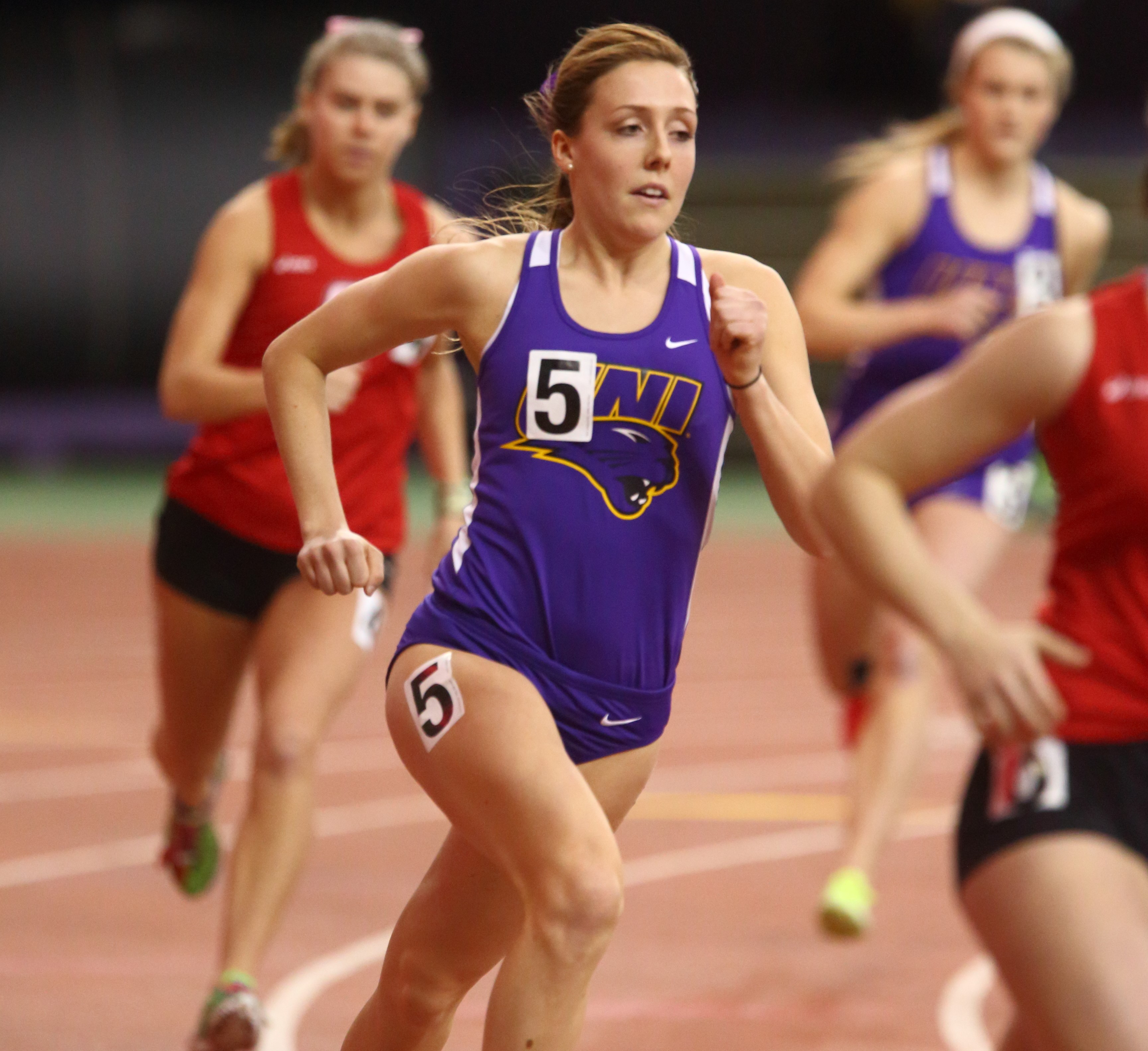 Alex Teubel running in UNI uniform