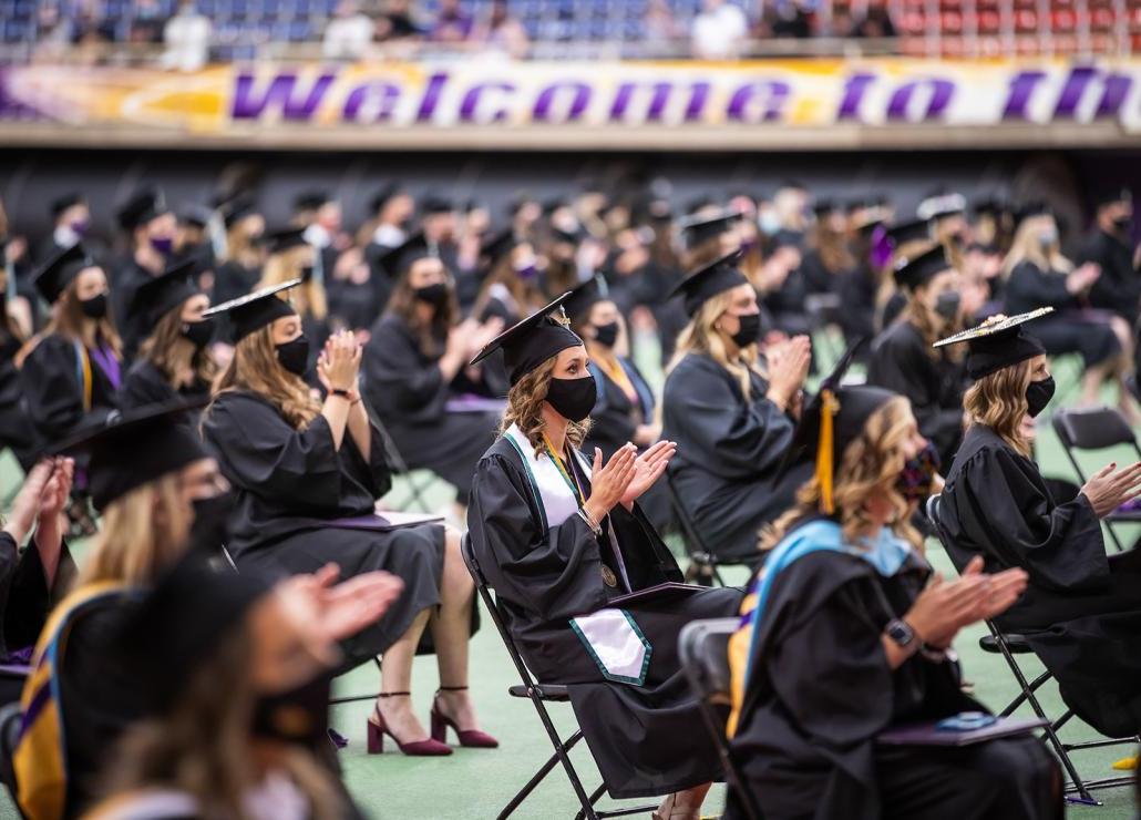 graduates clapping