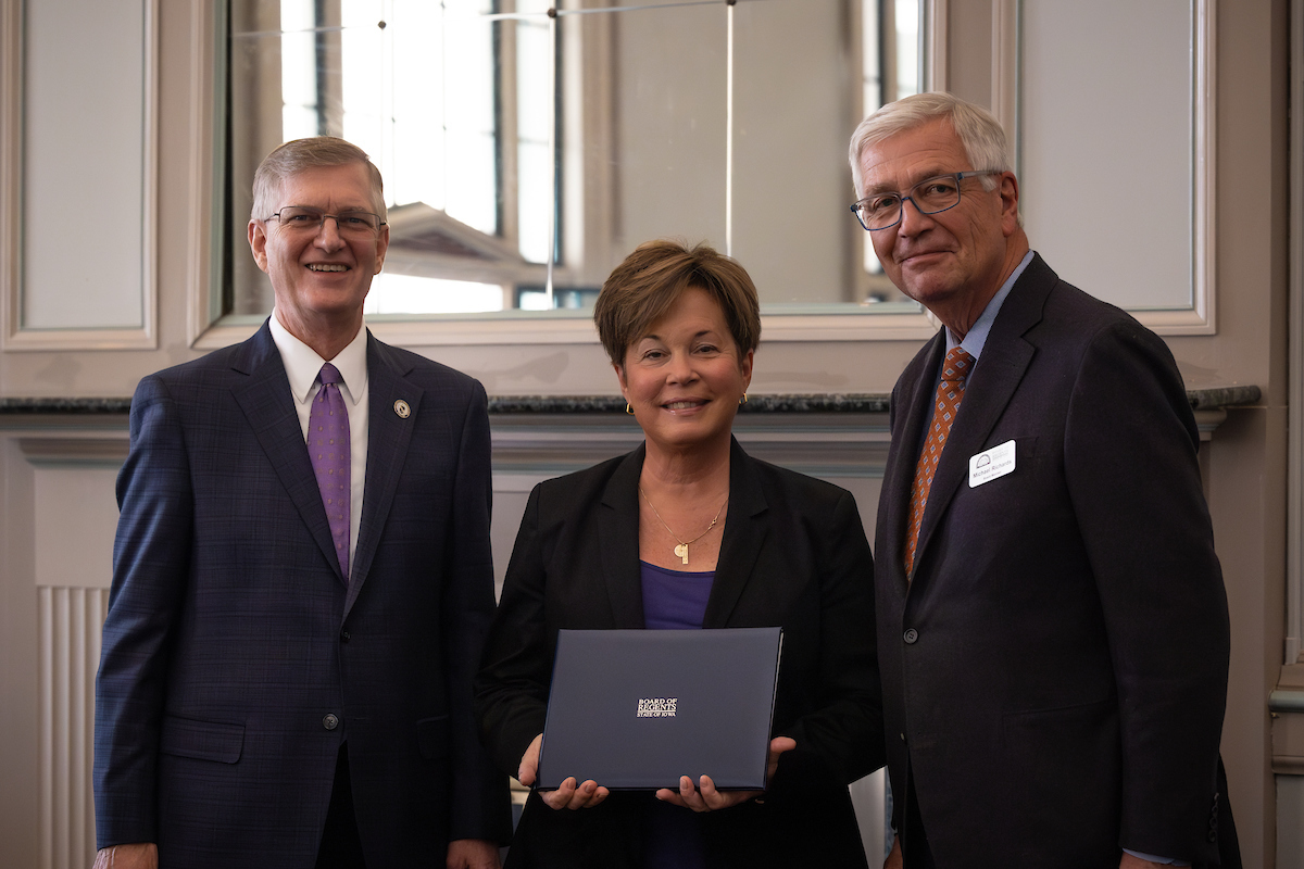 Cassie Luze with President Mark Nook and Board of Regents President Michael Richards