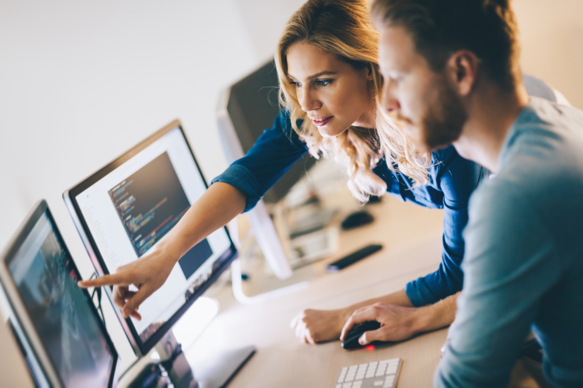 Man and woman working at computers