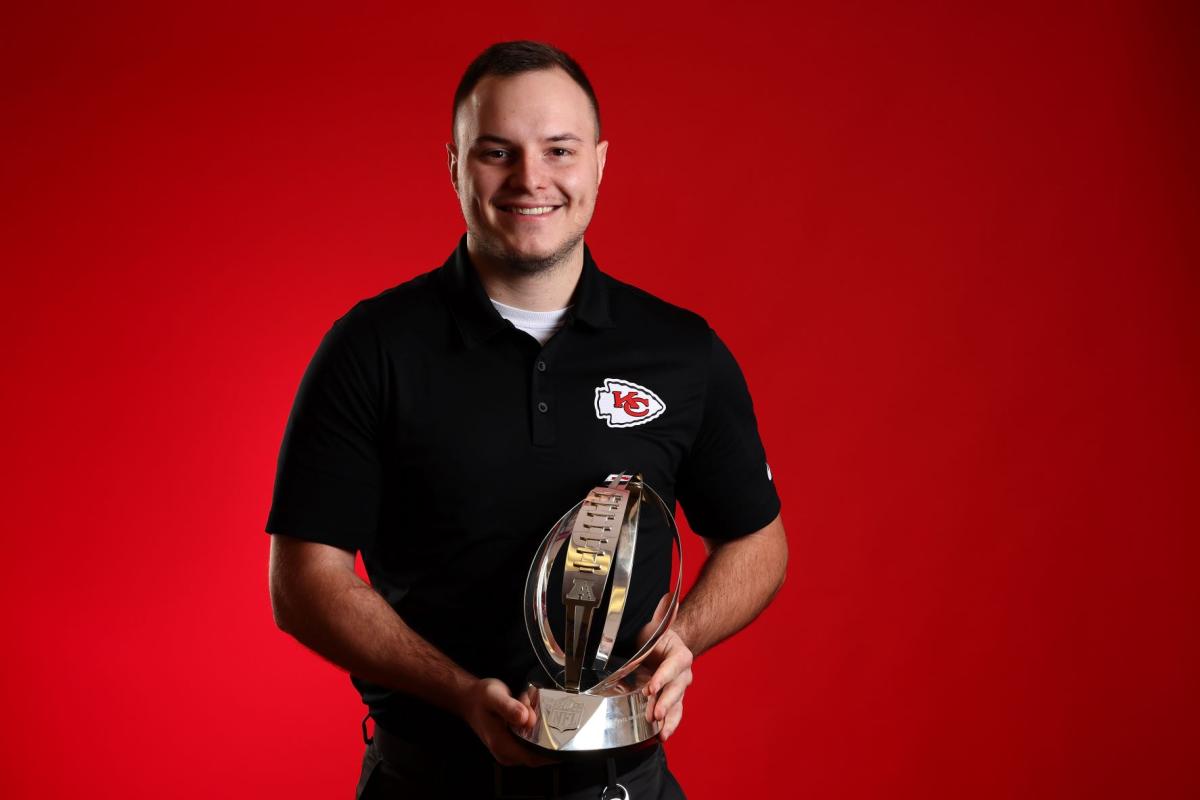 Aaron Dzaboff holding AFC trophy