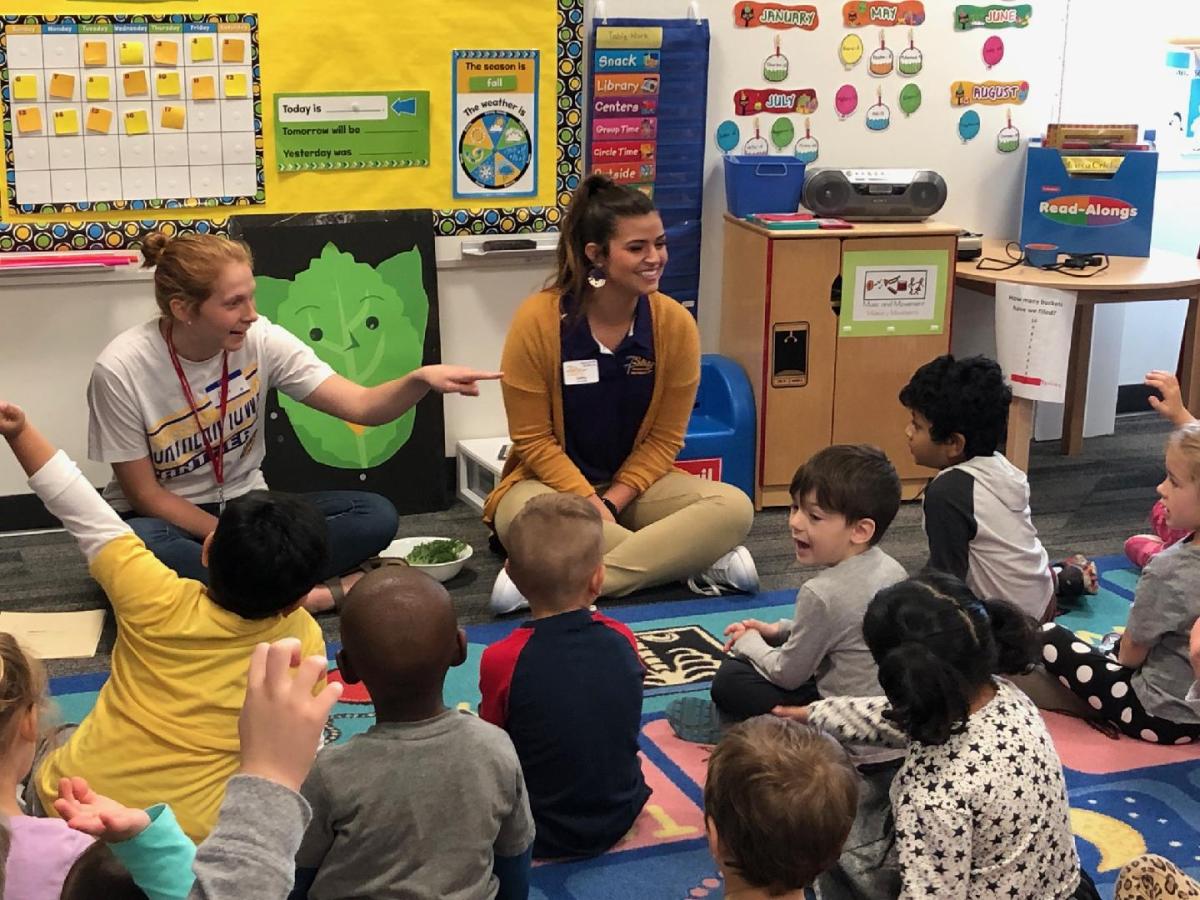 Public health majors introducing students to fresh produce