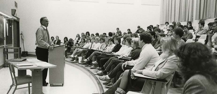 Professor speaking to his class.