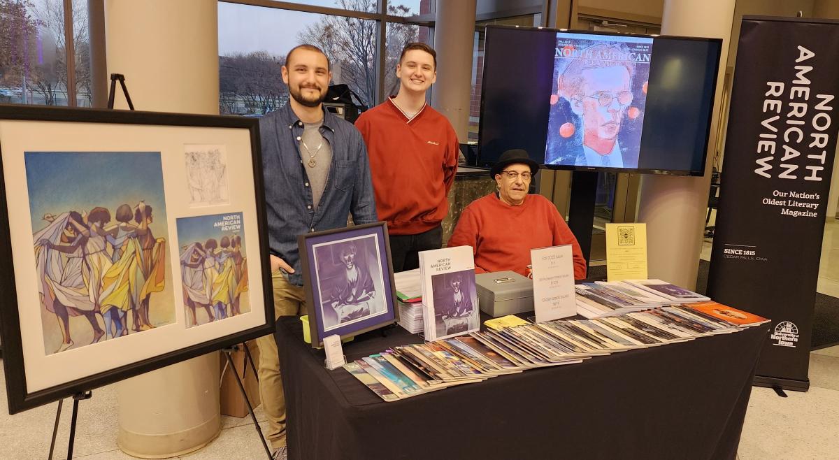 Jake Volk standing with student Nolan Rochford and NAR editor Grant Tracey