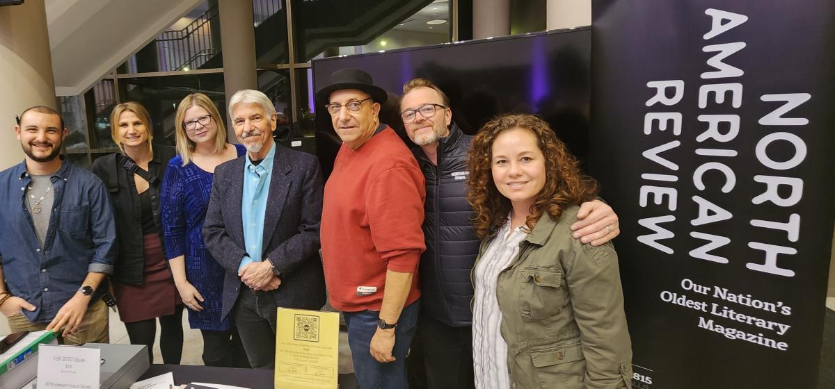 Jake Volk standing with NAR editors and contributors