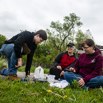 Green Iowa AmeriCorps members work on a water quality project.