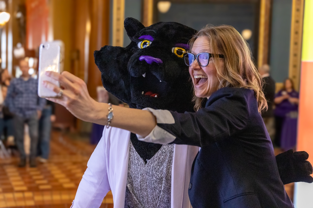 Woman taking a selfie with TK the mascot at UNI Day at the Capitol