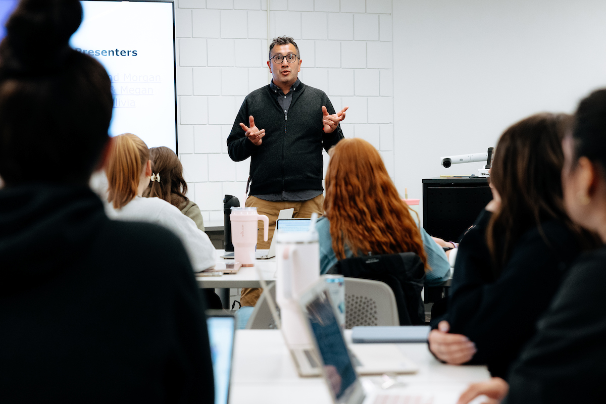 Faculty member in classroom teaching students