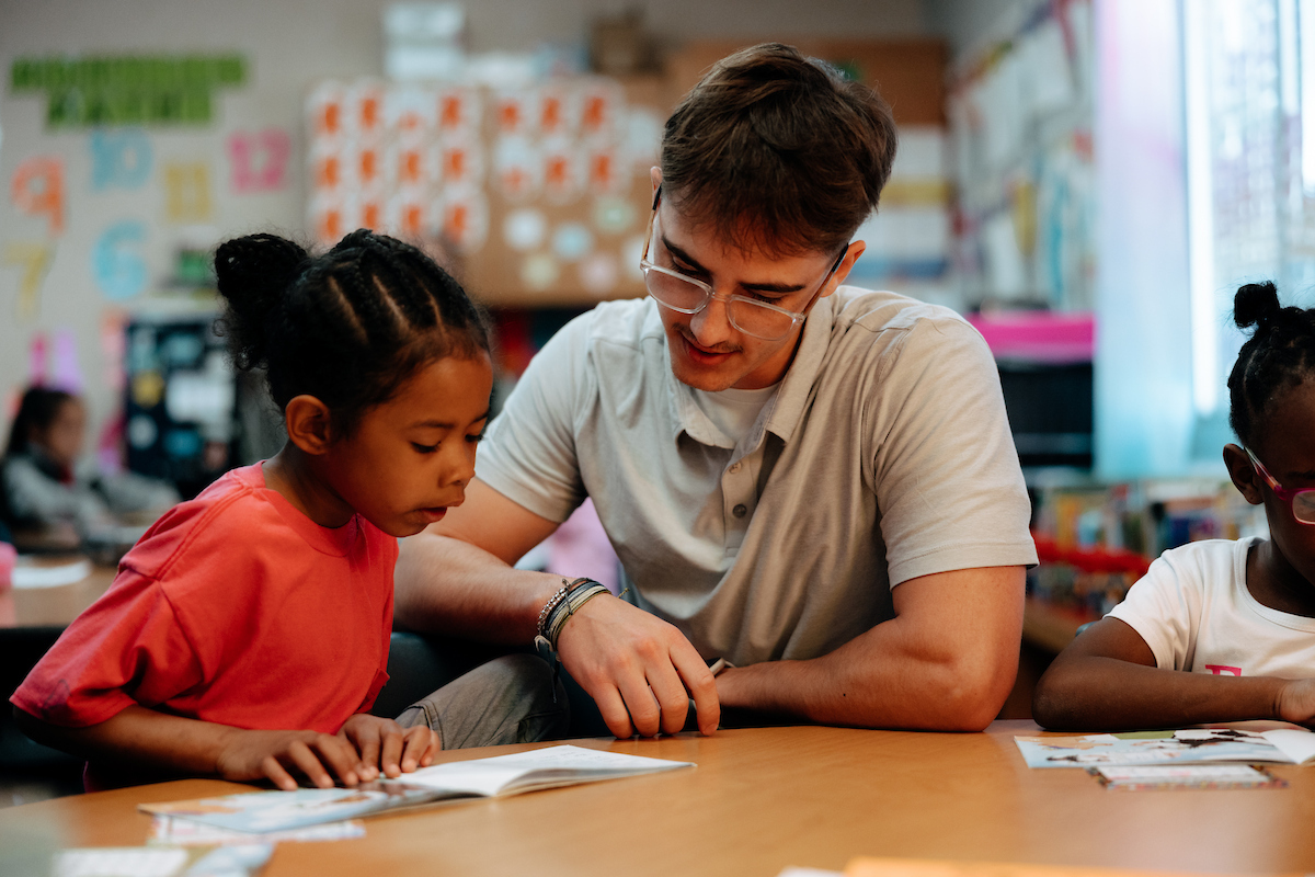 Student teacher working one-on-one with young student