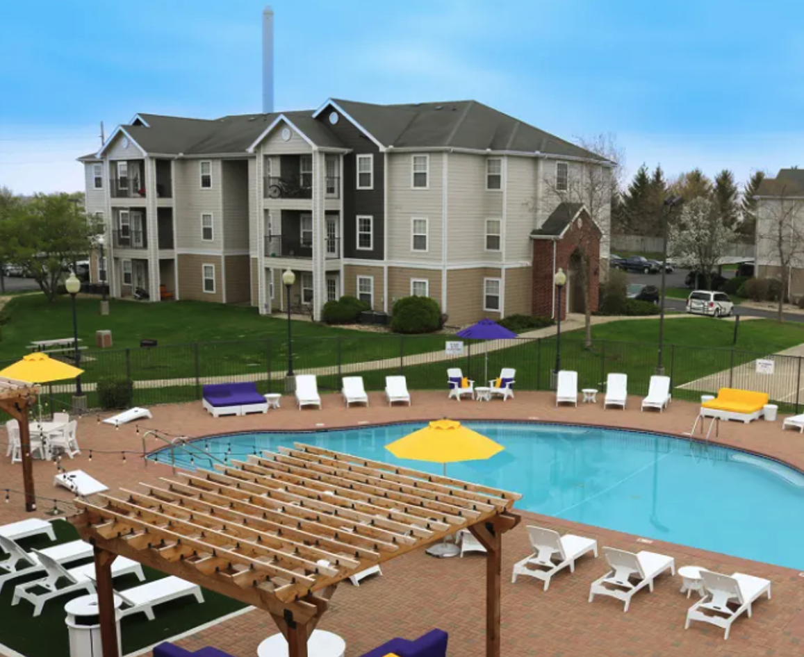 Exterior of The Quarters apartment complex, overlooking swimming pool