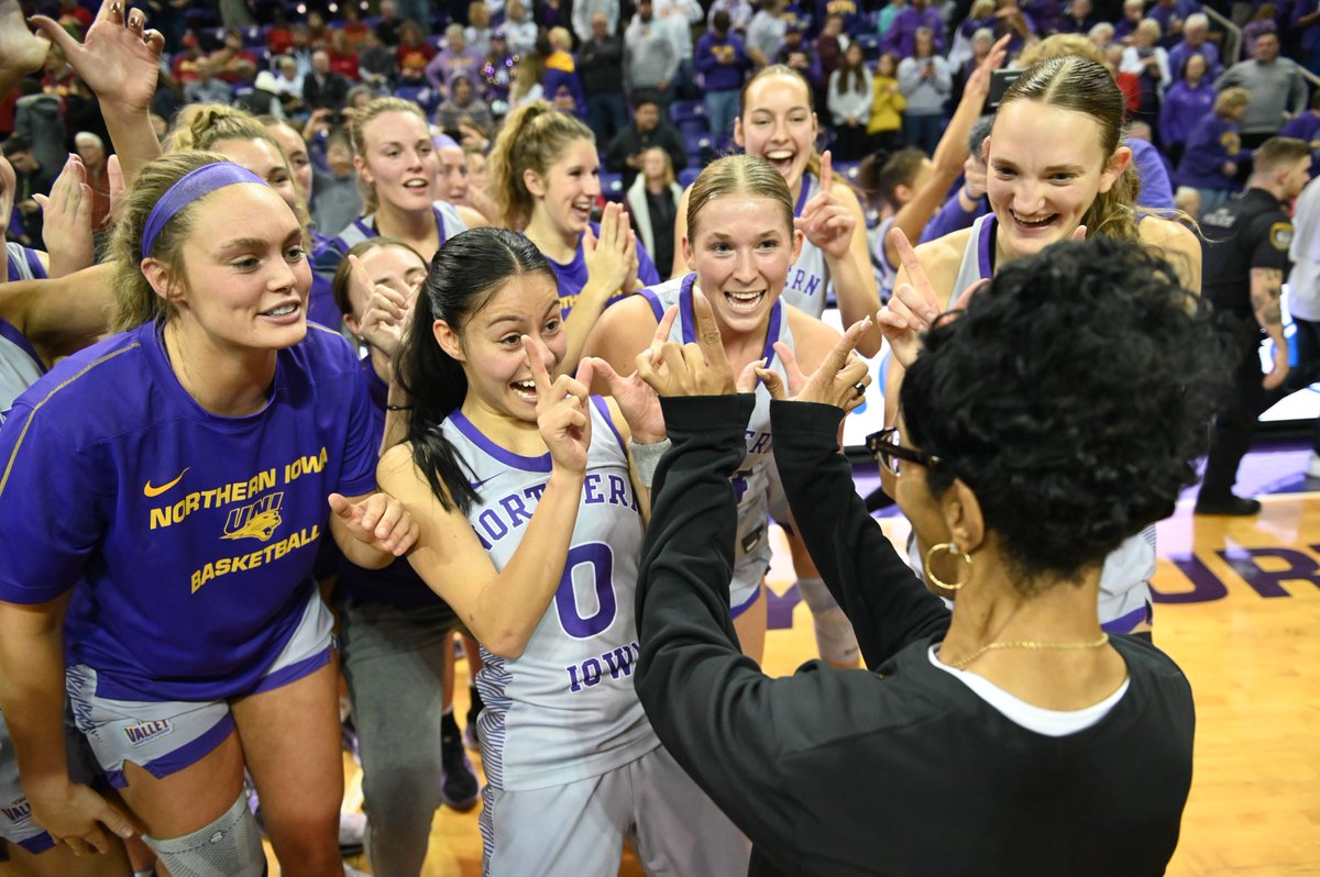 UNI Women's Basketball celebrates with coach Tanya Warren