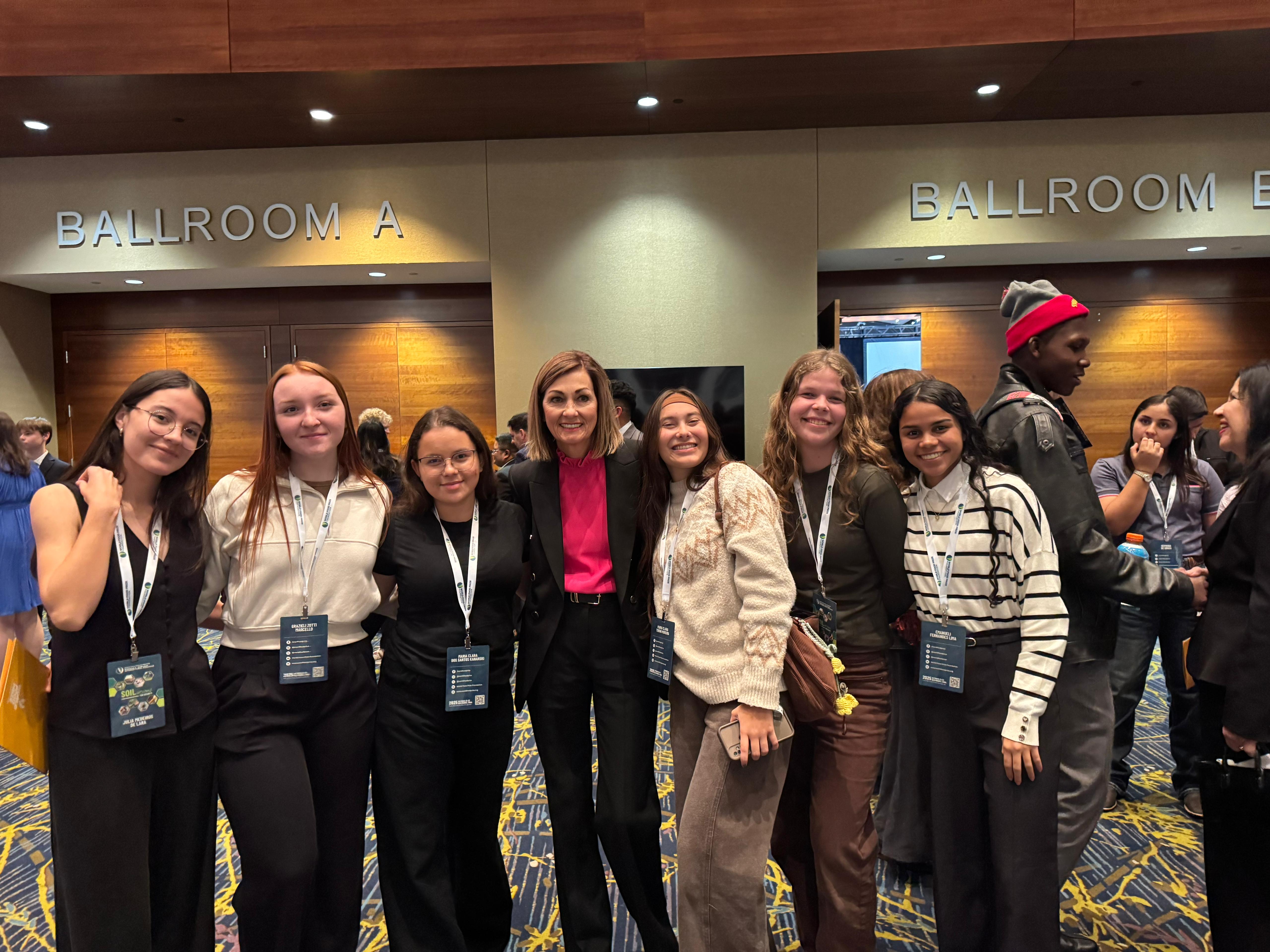 Brazilian students with Gov. Kim Reynolds