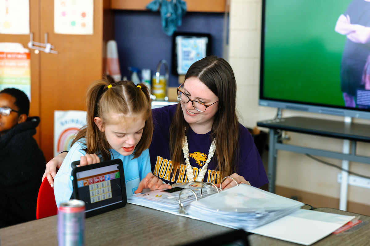 Student teacher working with special needs student