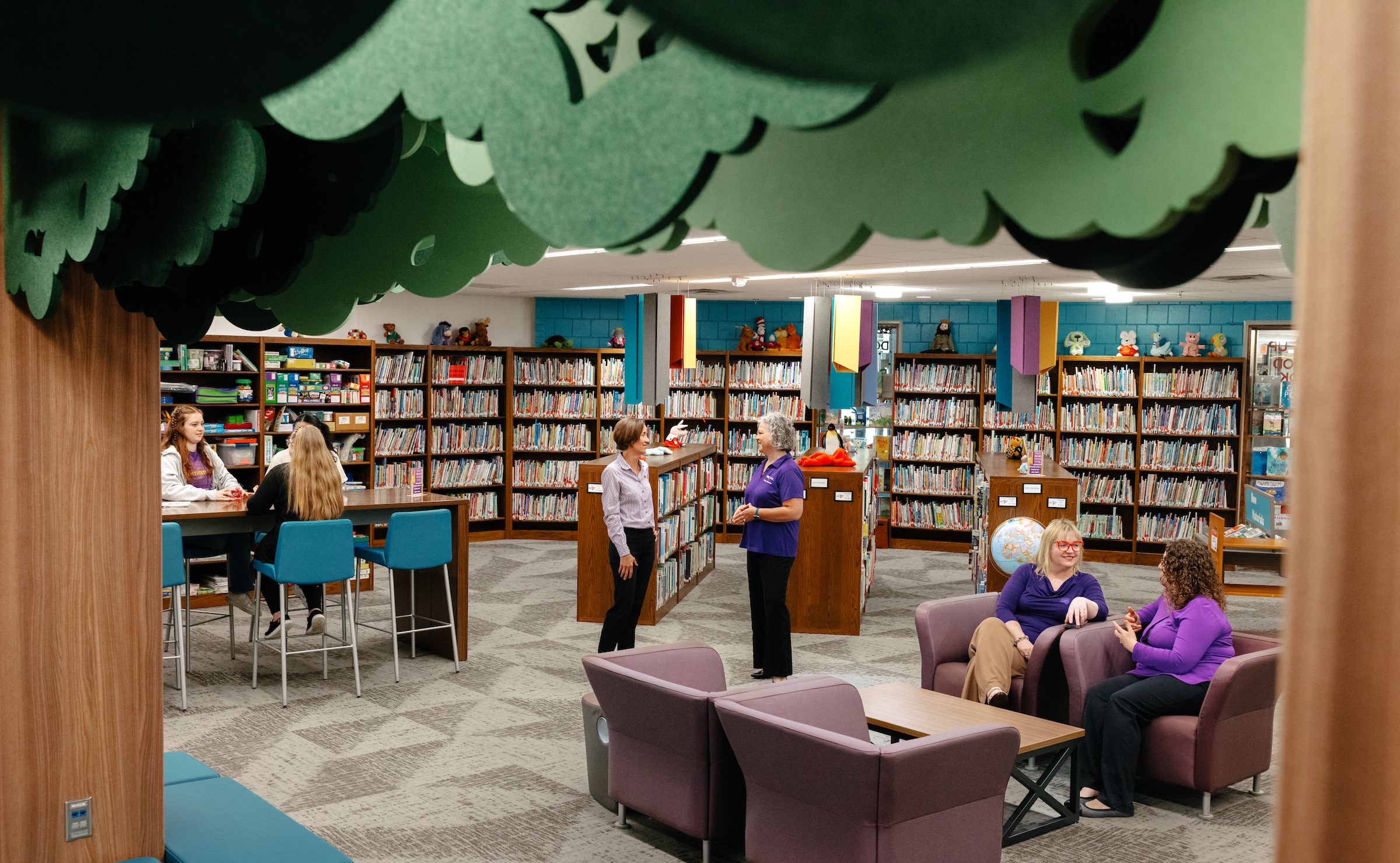 A portrait of the TEACH Studio space and faculty and students enjoying it