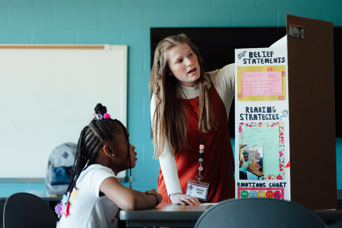 Teacher working with student