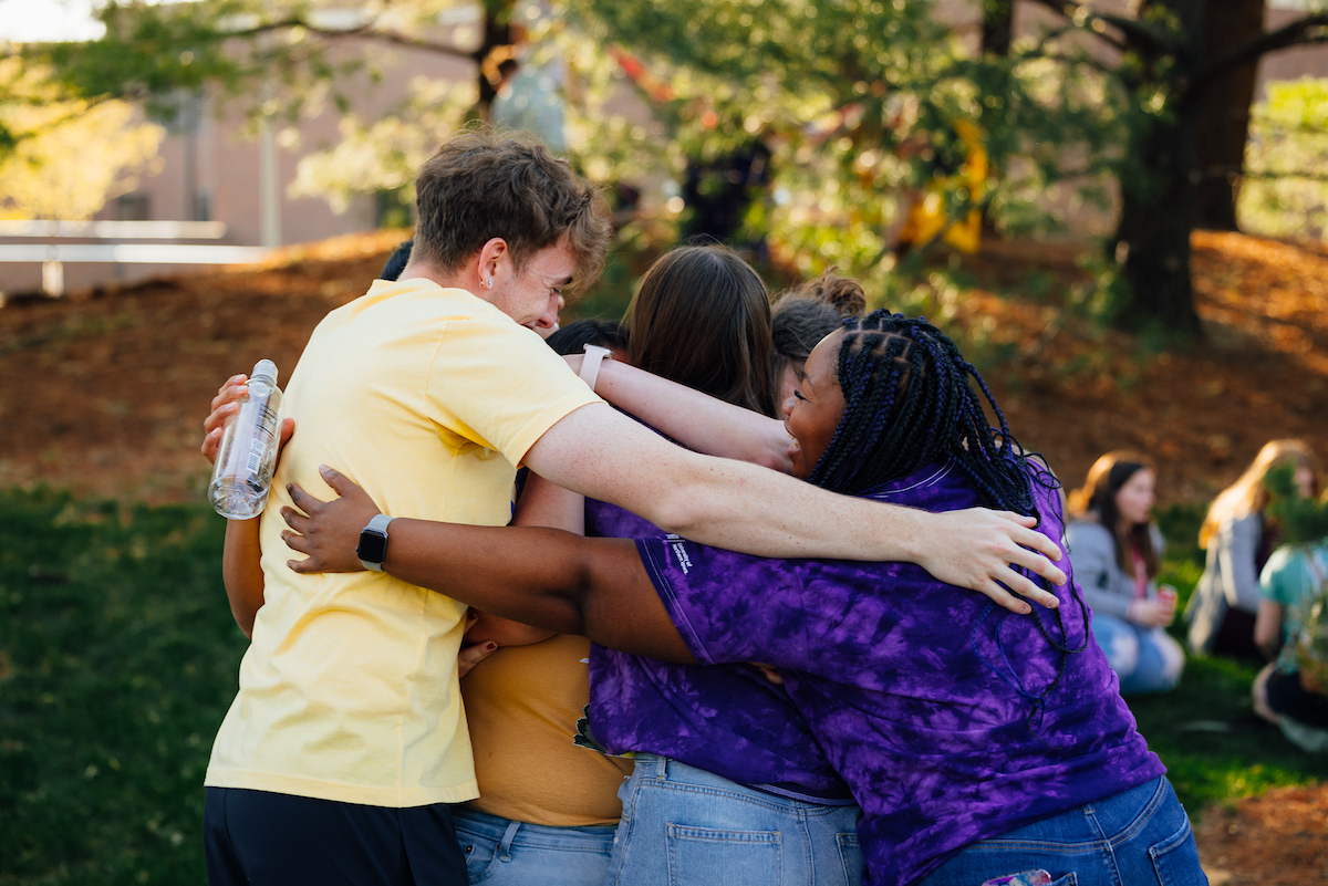 Students hugging each other on UNI campus