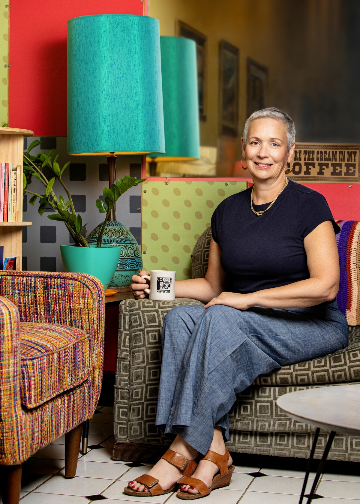 Dawn Wilson sitting down with a cup of coffee at Cup of Joe