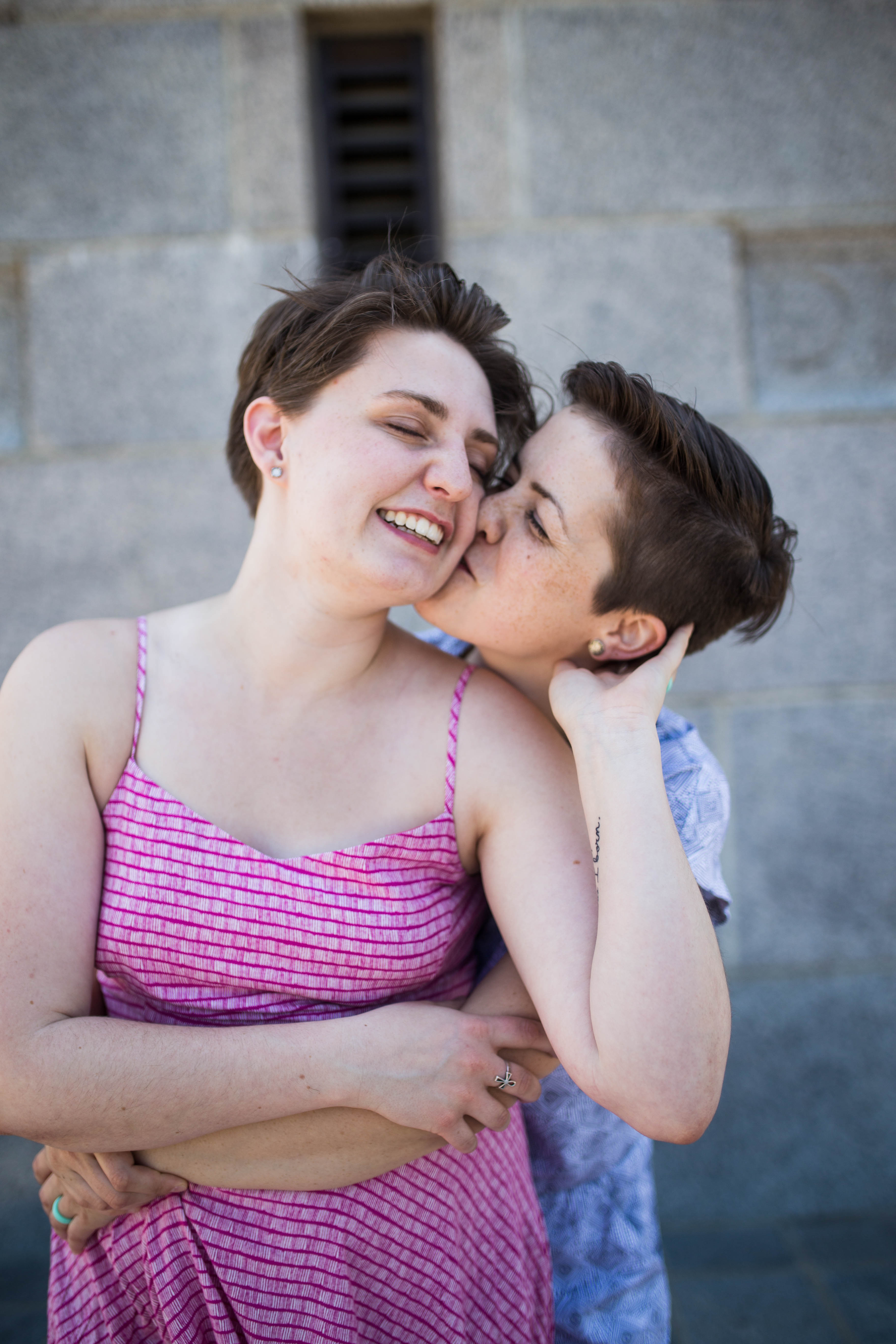 Young couple kissing in front of the Campanile