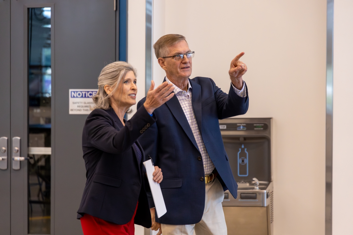 Joni Ernst being shown around the Applied Engineering Building by President Mark Nook