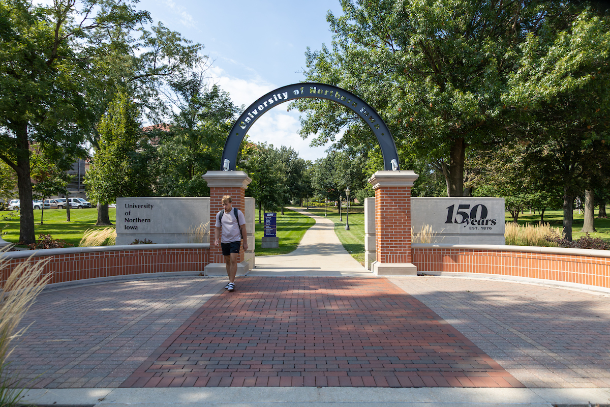 Student walking on UNI campus
