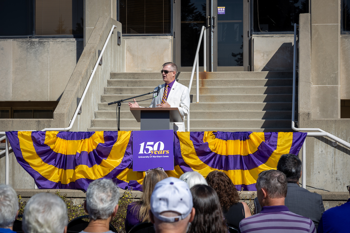 President Nook speaking at podium at sesquicentennial event