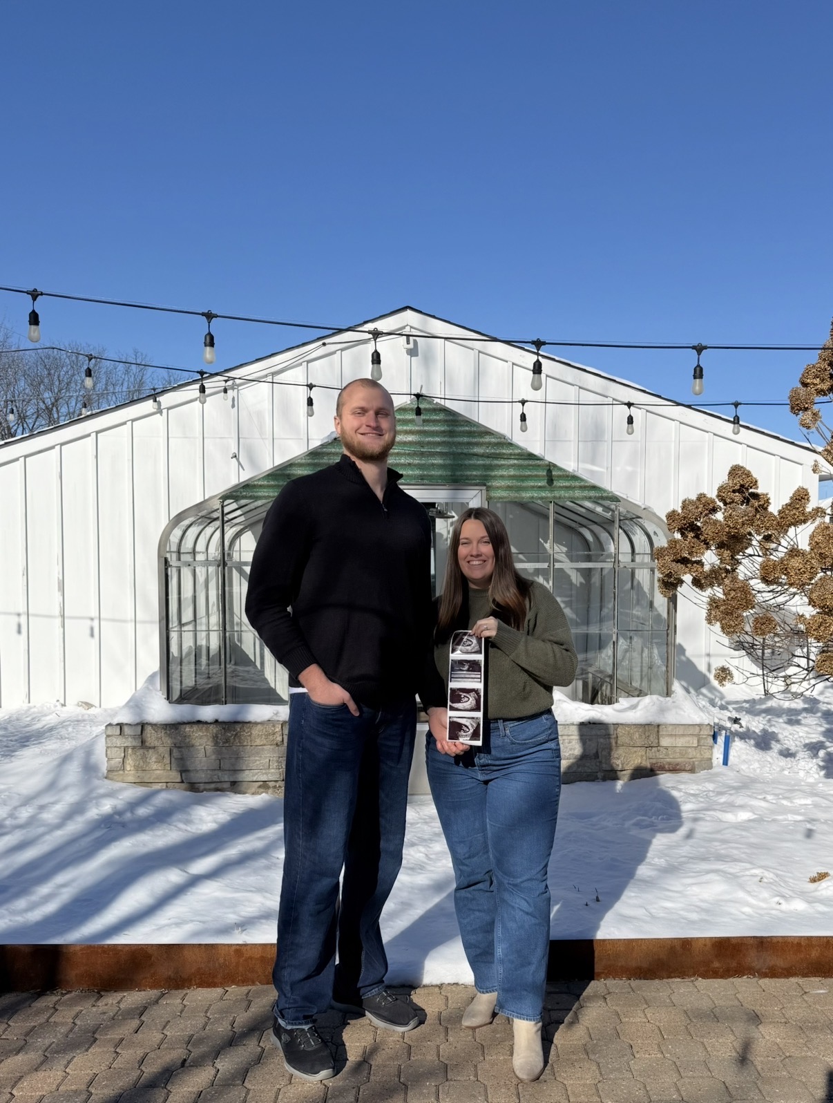 Young couple showing ultrasound