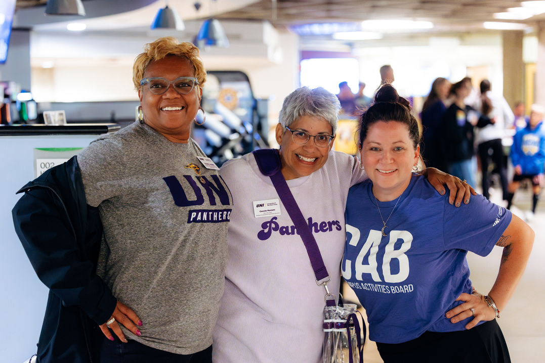 UNI employees gather together for a photo.