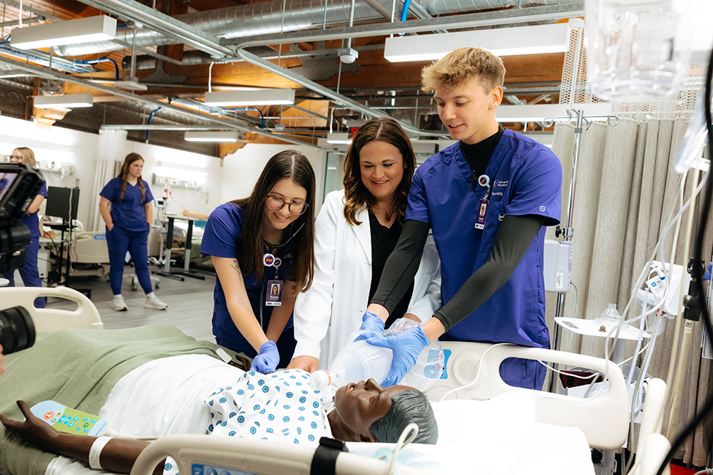 Students practicing on a syndaver.