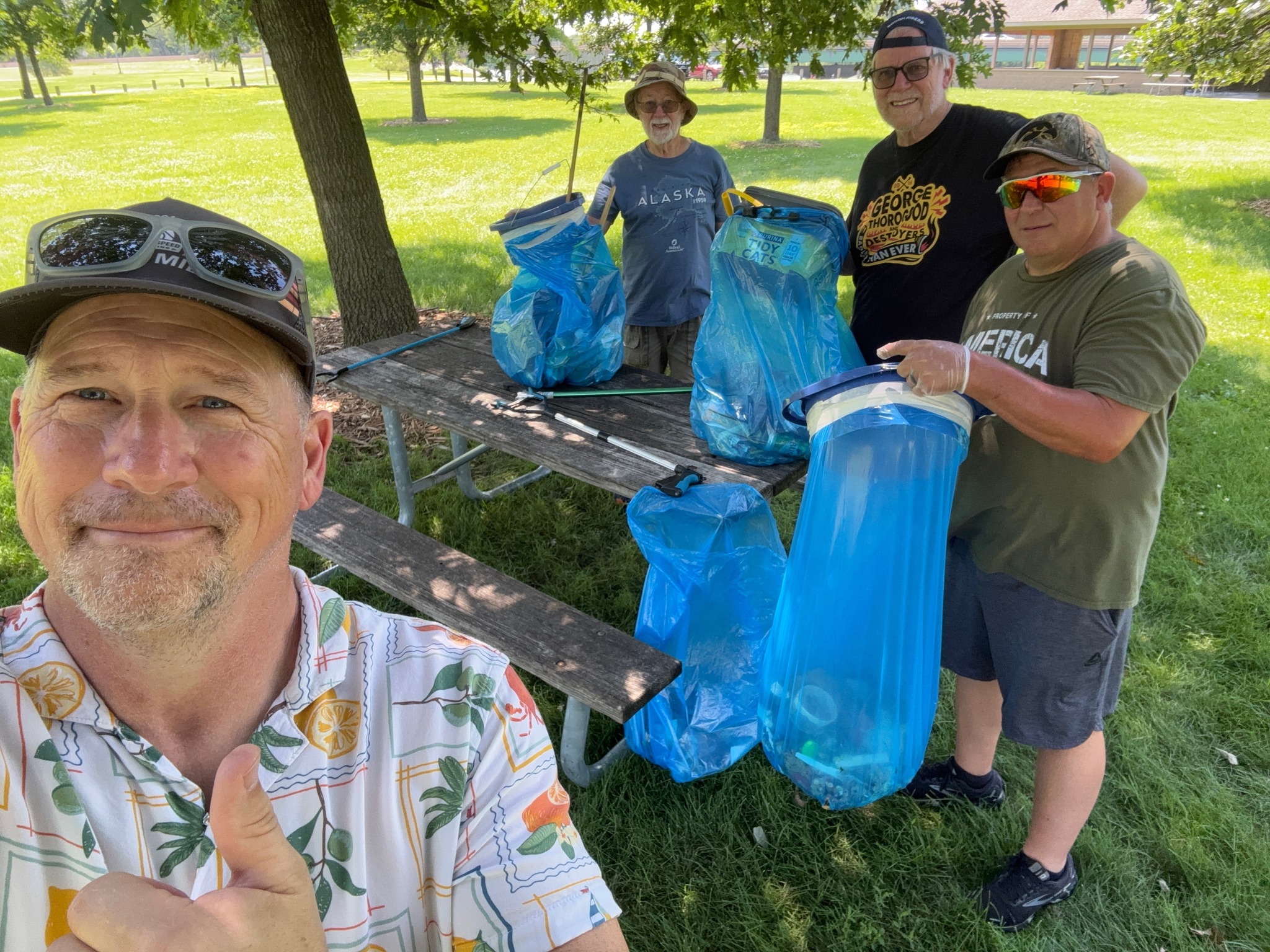 Men's Sheds participants cleaning up litter outside