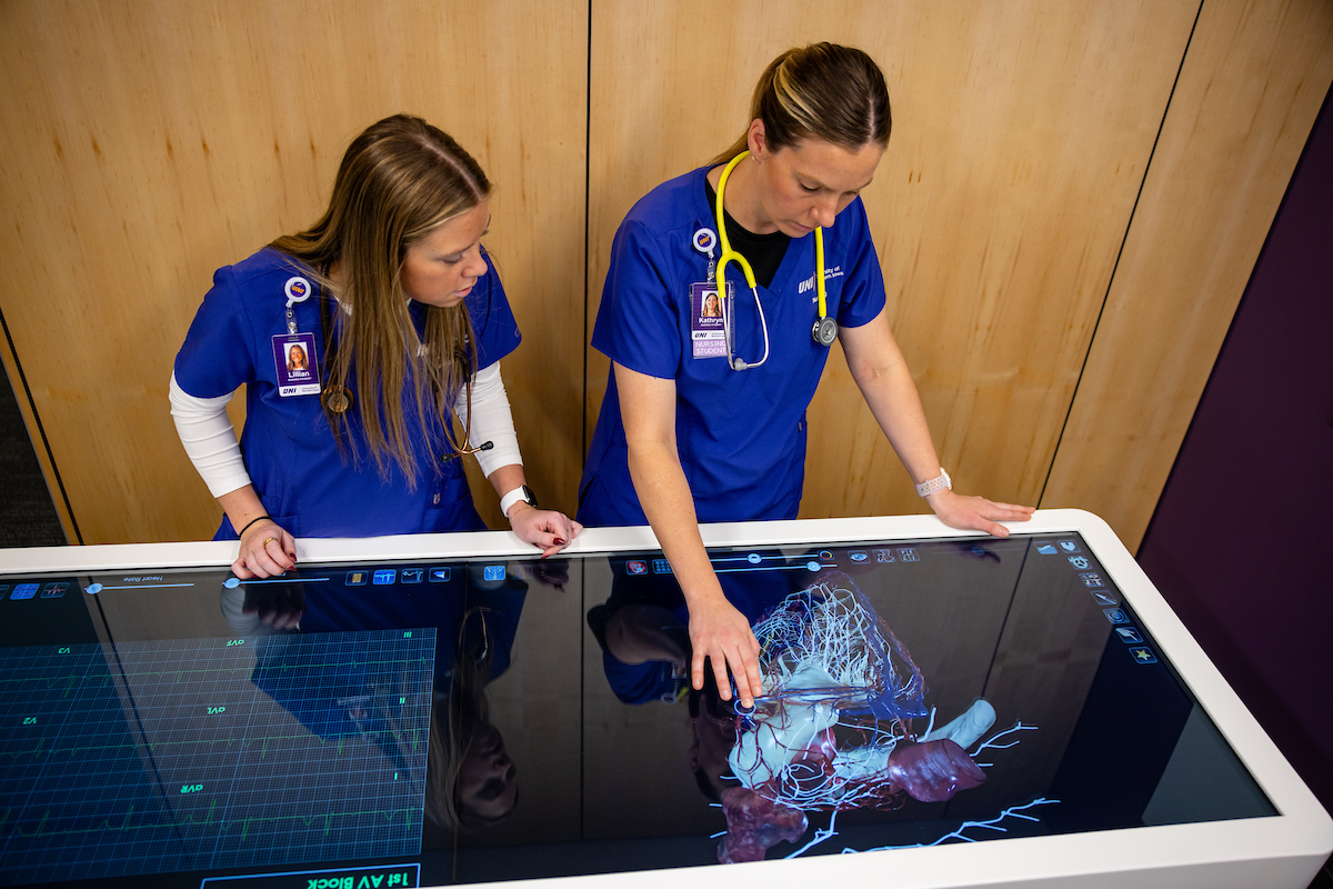 Nursing students with anatomage table